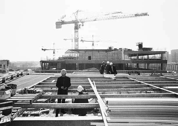 Professional construction workers and engineers at a construction site
